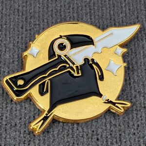 Black and Gold Raven Holding a Dagger in its Beak Enamel Pin